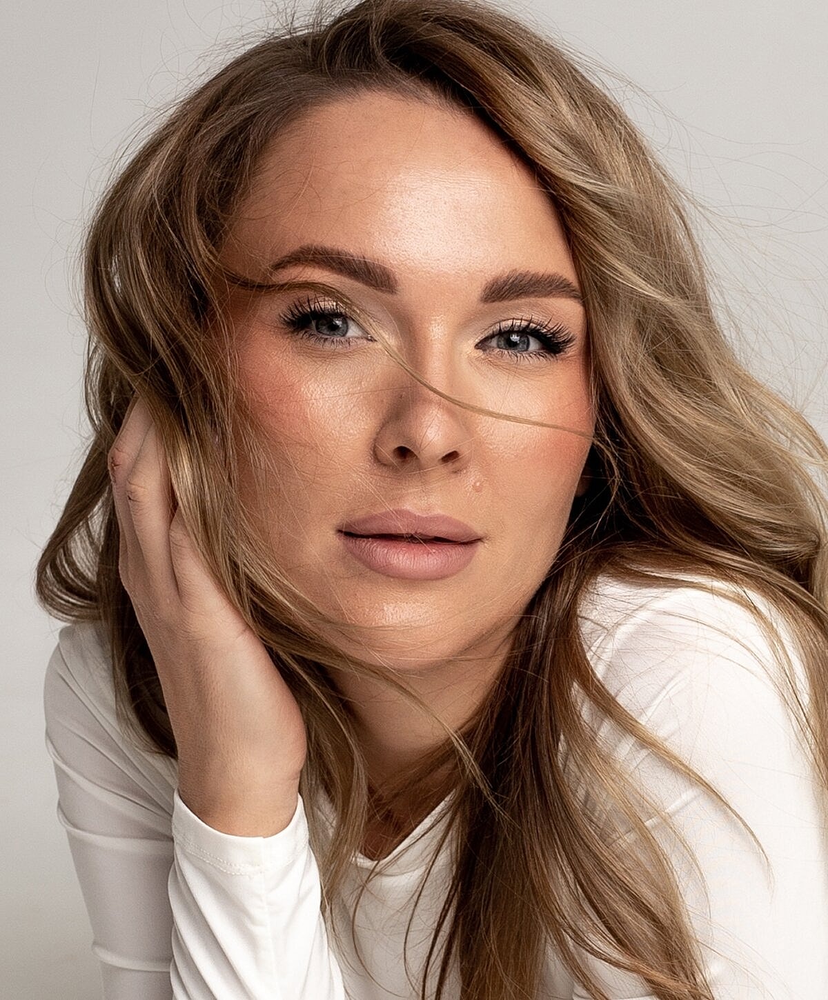 Denver Chemical Peels model with flowing hair and natural makeup.