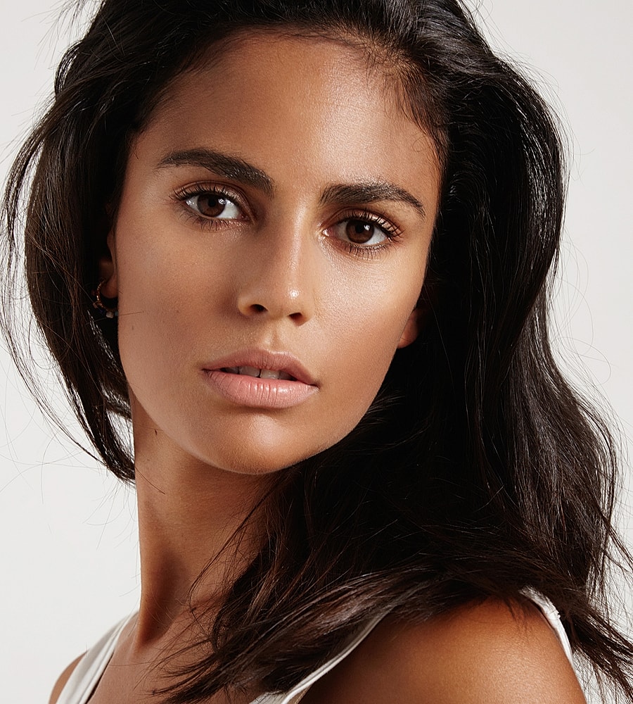 Close-up portrait of a woman with dark hair.