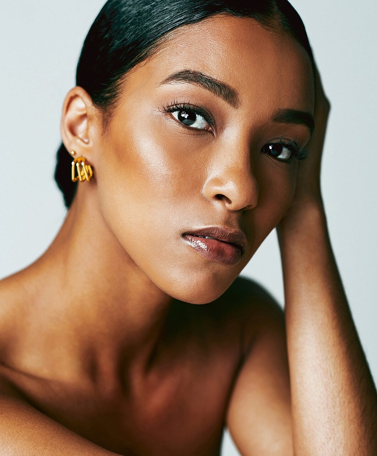 Close-up portrait of a woman with elegant jewelry.
