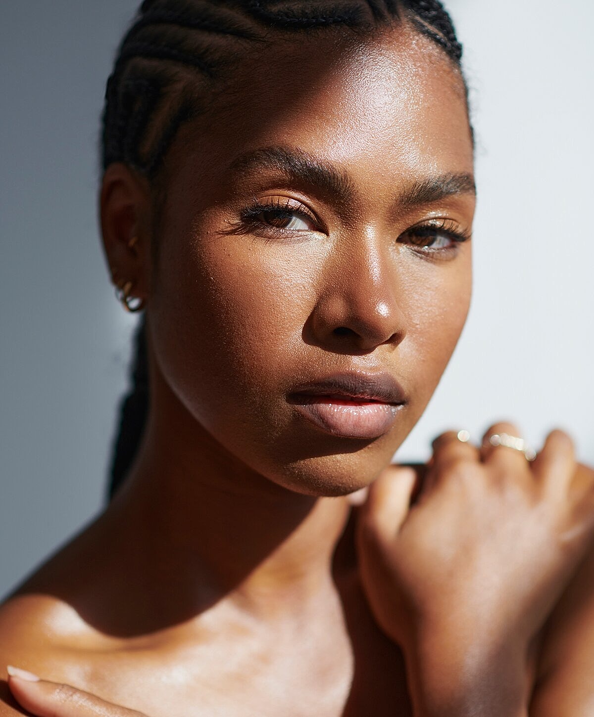 Portrait of a woman with braided hair.
