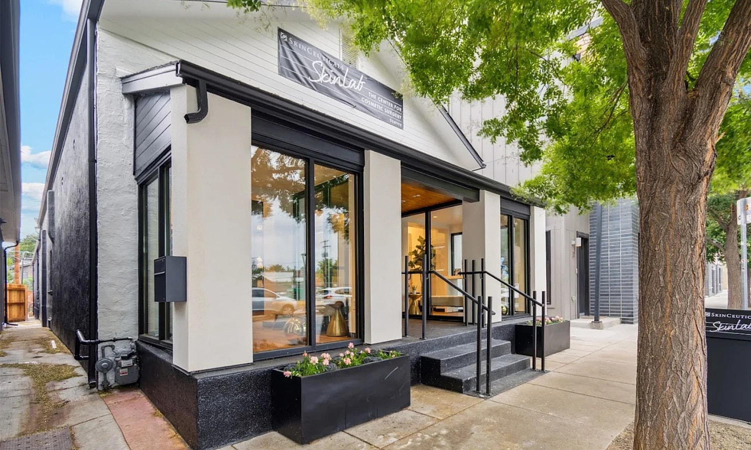 Modern cosmetic surgery clinic exterior with steps.