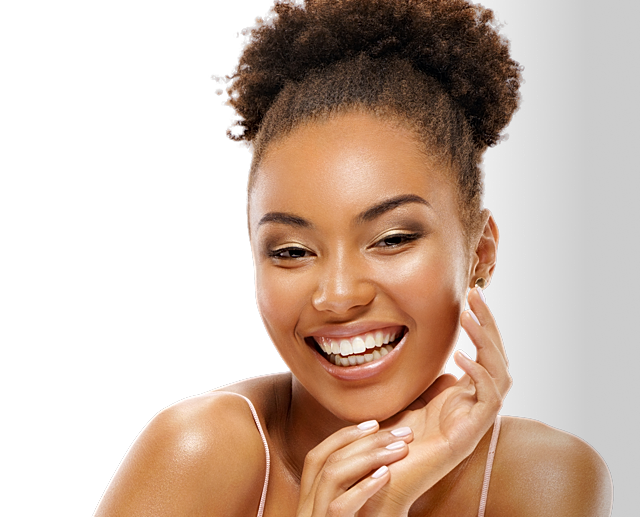 Smiling woman with curly hair on black background.